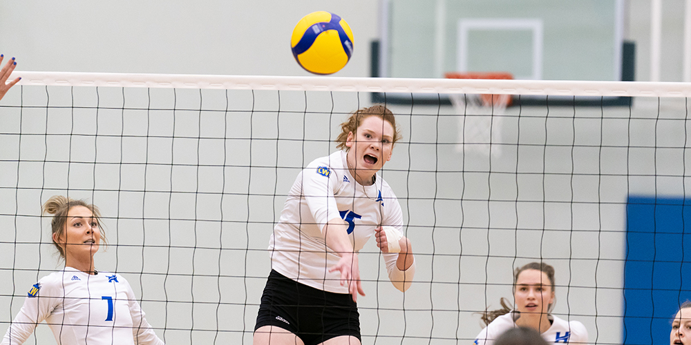 Player spiking the ball at a Women's UBCO Heat volleyball game