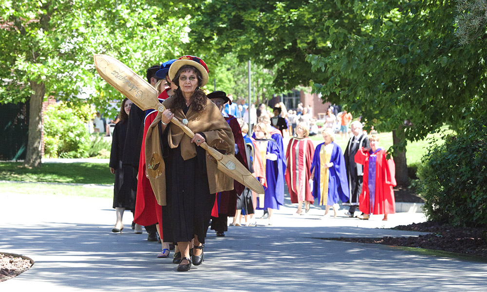 Jeannette Armstrong leading a procession of UBCO faculty members.